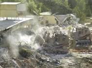 bulldozer destroying buildings