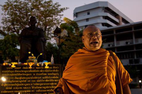 A monk supporting the "Fearlessness Walk" at Thammasat University, Bangkok. Demotix/Lillian Suwanrumpha. All Rights Reserved.