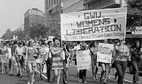 Women marching holding a banner in Washington DC, 1970