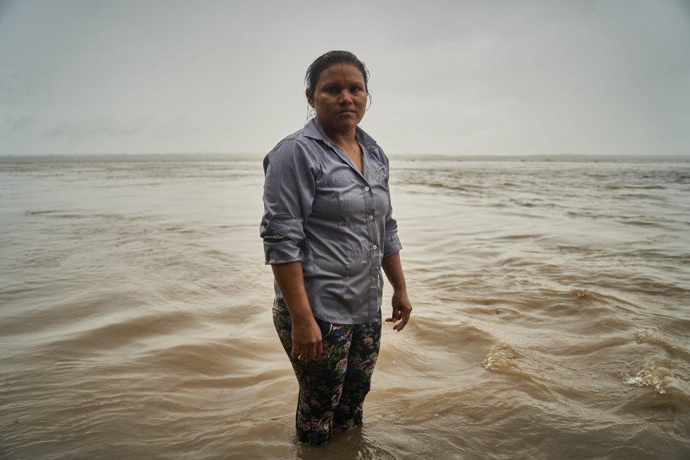 Lilia poses for a portrait on the Amazon River. Her path, like that of so many other indigenous women, has been of permanent fight and determination.