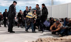 Lampedusan authorities disembark migrants from Libya, February 2015. 