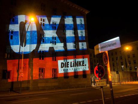 ‘OXI’ projected onto the German Finance Ministry by Die Linke. Flickr/Fraktion die linke. Some rights reserved.
