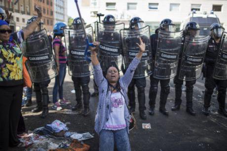 Women protest an eviction in Rome, August 2017.