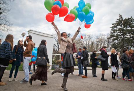 A girl with balloons in Roma flag colours, International Day of the Roma, Bucharest 2015