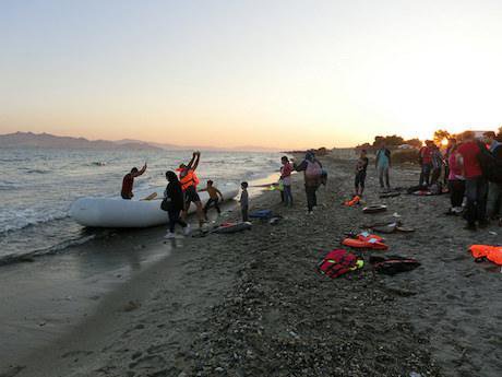A boat of fifty migrants and refugees arrives from Bodrum, Turkey onto the island of Kos, Greece in September, 2015.