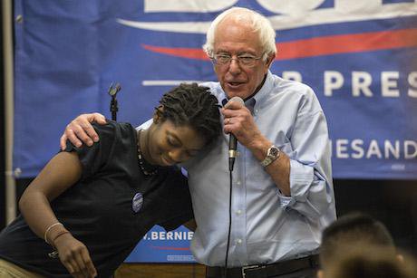 Bernie Sanders hugs a student on a campaign event at Creative Visions, September 27, 2015. Phil Roeder/Flickr. Some rights reser