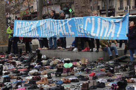 Empty shoes replace Paris climate march. Flickr/John Englart (Takver). Some rights reserved.