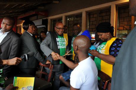 President Jacob Zuma greets patrons in the town of Katlehong, Johannesburg as he conducts an election campaign