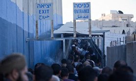 Palestinian workers continue their daily wait to cross into Israel. Demotix/Hussain Abdel Jawwad. All rights reserved.