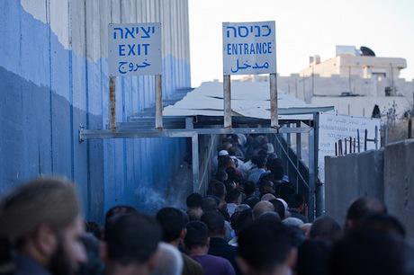Palestinian workers continue their daily wait to cross into Israel. Demotix/Hussain Abdel Jawwad. All rights reserved.
