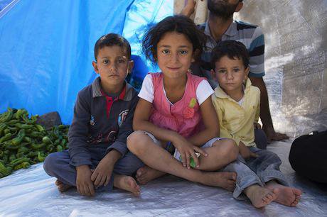 Syrian refugee children in a makeshift shelter. Demotix/Matthew Aslett. All rights reserved.
