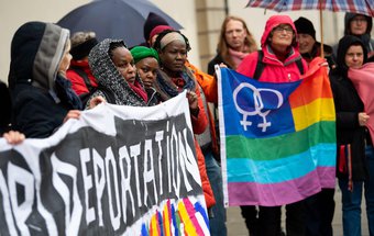 Demonstrators hold a poster in front of Bavarian Administrative Court with the inscription "Stop Deportation for LGBTIQ* & ALL". Asylum application of a lesbian woman from Uganda was to be heard. Munich, Germany, 9 March, 2020.