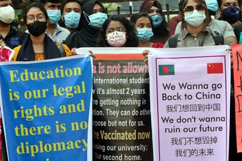 Bangladeshi students of different universities from China, hold placards during a protest, to demand the intervention of the Bangladesh government to can return to China. Students are stranded in Bangladesh unable to return to China, due to the closed bor