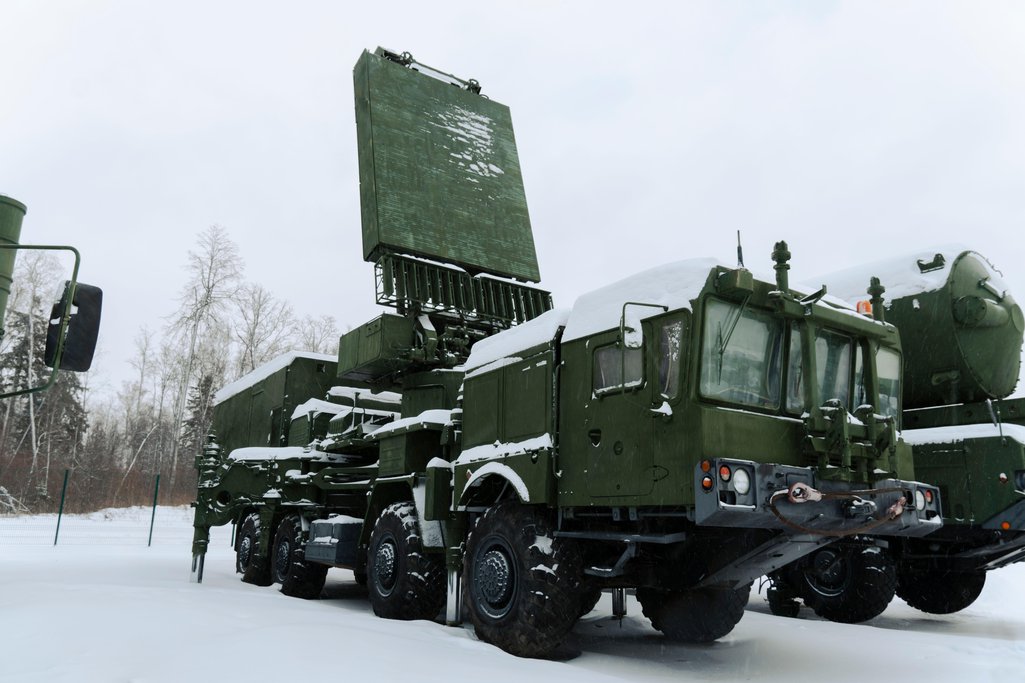 Heavy military equipment of the Russian armed forces against the background of a winter forest
