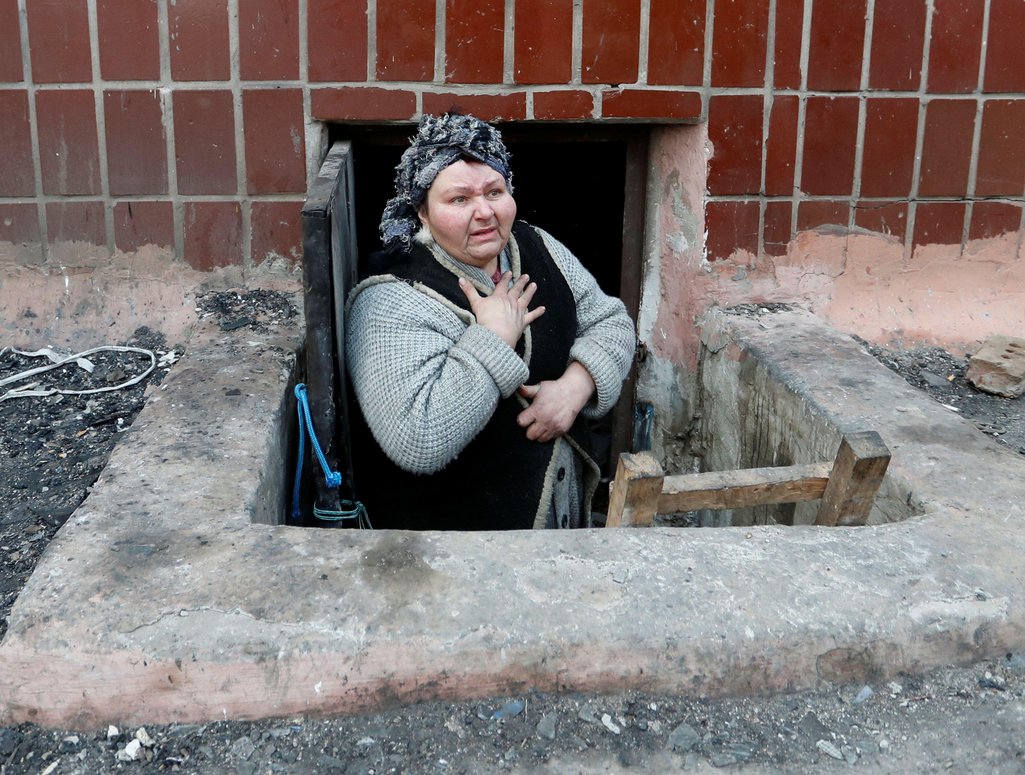 A local resident who seeks refuge in the basement of a building during Ukraine-Russia conflict is seen in the besieged southern port city of Mariupol, Ukraine March 18, 2022