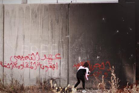 3. A girl tags the Israeli separation wall near Bil’in, in the West Bank. Photo Daniel Avelar copy.jpg