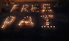Candles at a protest against the detainment of activist Jatupat Boonpattararaksa.