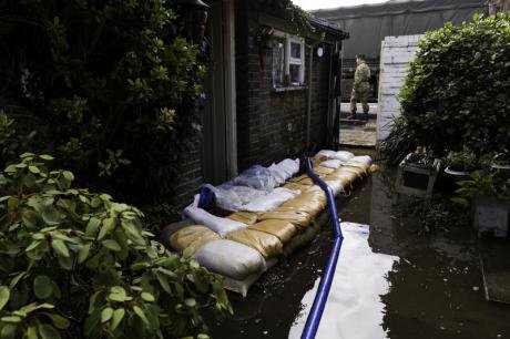 The army securing a house in Surrey following the flooding