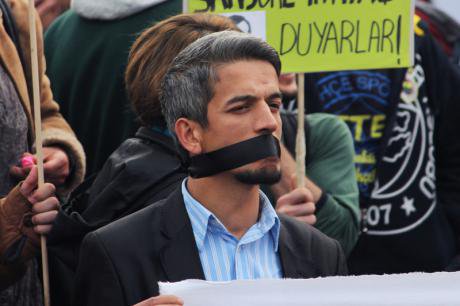 A demonstrator in Turkey protests against government censorship.