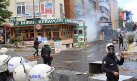 Turkish police fire tear gas on May day protesters, 2014.