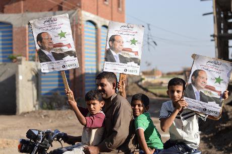 In Dirin village near Mansoura, a man with a motorcycle campaigns for Sisi