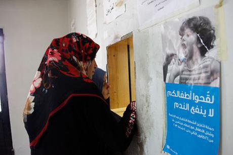 Two Syrian women wait to collect a prescription at a health clinic in Lebanon&#39;s Bekaa Valley, 2013.