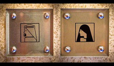 Bathroom signs in Burj Al-Arab. Flickr/Asim Bharwani. Some rights reserved.