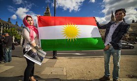 Protesters in London hold up the Kurdish flag. Demotix/Guy Corbishly. ALl rights reserved.
