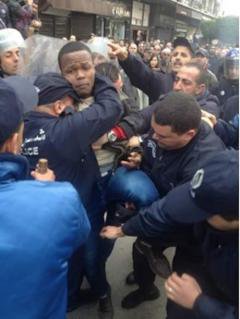 5 A young activist being tackled by riot police in Algiers – Source- Adlène Meddi _0.jpg