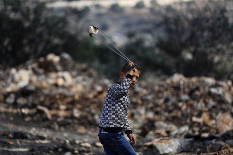 Palestinian boy with a slingshot. Ahmed Talat/Demotix. All rights reserved.