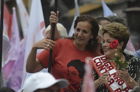 Dilma Rousseff throws flowers to supporters, 2014. Demotix/Fabio Teixeira. All rights reserved.