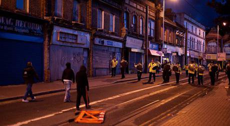Stand-off between rioters and police in Croydon, London 2011.
