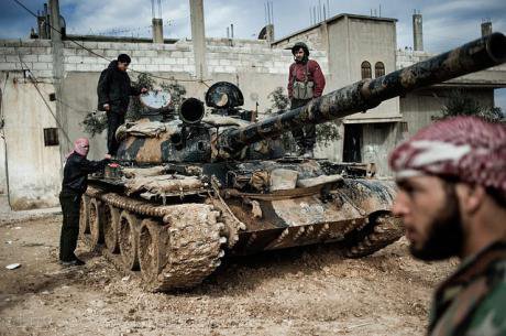 Free Syrian Army members with a tank whose crew defected from government forces. Freedom House/Flickr. Some rights reserved.