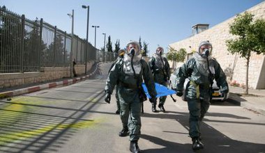 Security forces simulate chemical attack outside Israeli Parliament.