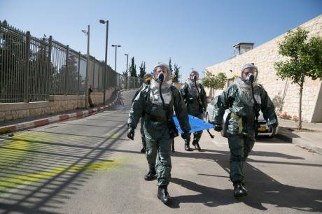 Security forces simulate chemical attack outside Israeli Parliament.