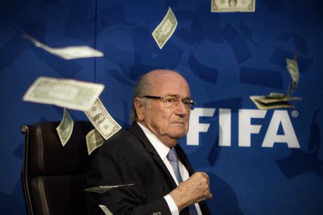 Seb Blatter showered with cash at a press conference in Zurich, July 2015.