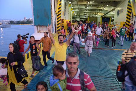 Refugees dropped daily at Piraeus Harbour,Greece. 