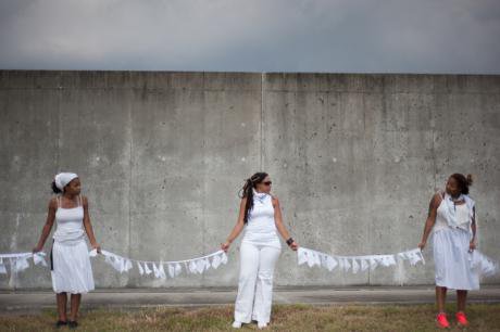 Black community members commemorate 10th anniversary of Hurricane Katrina. 