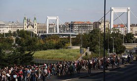 Migrants bound for Germany walk through the streets of Budapest. Demotix/Beata Zawrzel. All rights reserved.