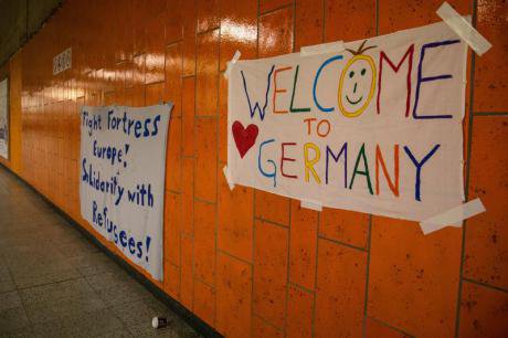 Volunteers prepare to welcome 1,000 refugees at Dortmund station. (Felix Huesmann/Demotix)