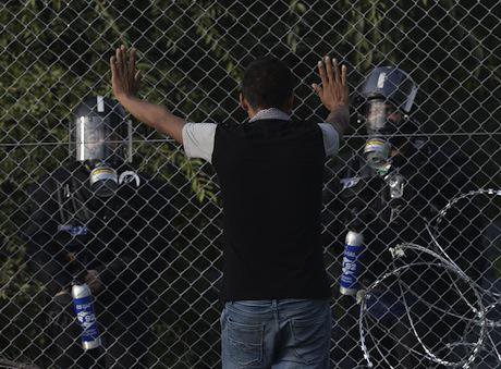 Migrants clash with riot police, close to Horgos, 2015. Demotix/Art Widak. All rights reserved.