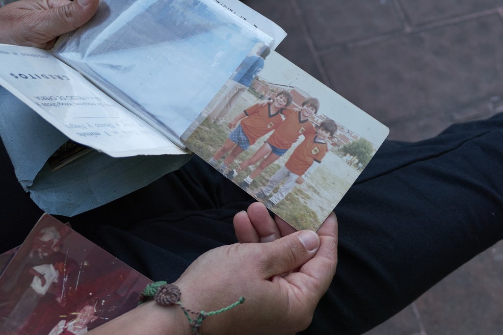 Cecilia Fregueiro holds a photograph of her nephew Santiago Canet, son of Silvia, who has been missing since 1994