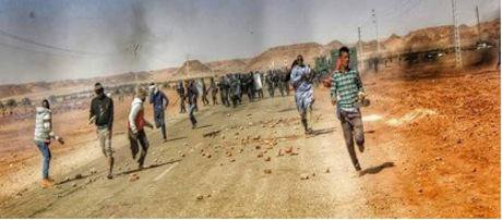 8 Unseen before – people of the Sahara throwing stones and running from police forces Source- Ain Salah Sun & Power_0.jpg