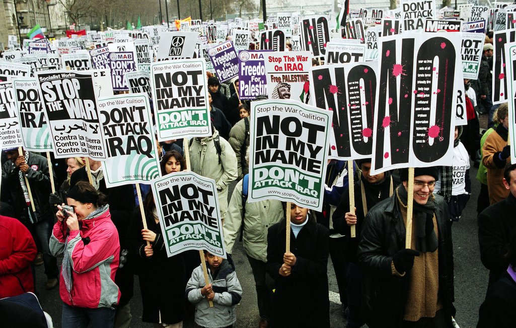 People attend a protest against the Iraq War in London