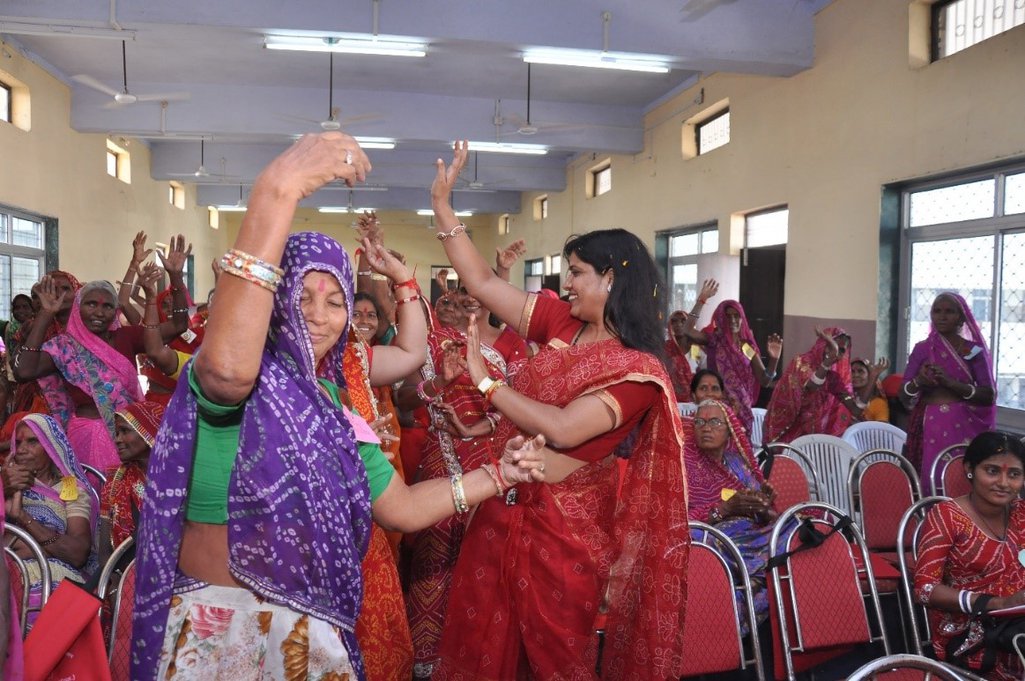 Women dancing to music and celebrating during the Behen Dooj festival last October
