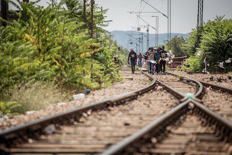 A group of migrants walk on the last leg of their crossing from Greece. Stephen Ryan:Flickr. Some rights reserved.jpg