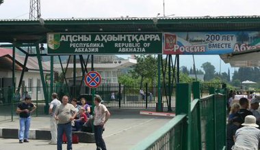 Border crossing in Abkhazia. The sign on the right reads 'Abkhazia and Russia, 200 years together.' 