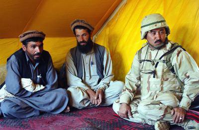 Afghan_residents_and_Afghan_interpreter_in_2002.jpg