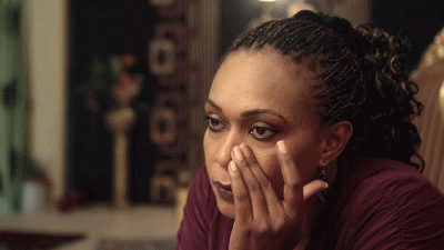 Woman wiping a tear away