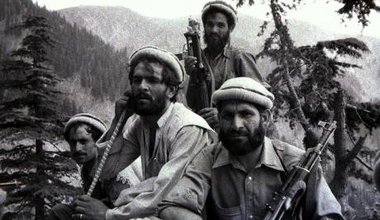 Black and white photo of several armed Mujahideen